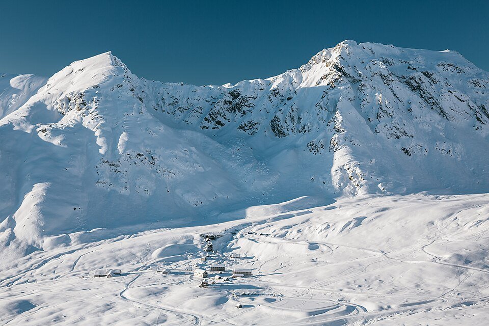 Snow-covered mountains above the small Independence Mine camp in winter