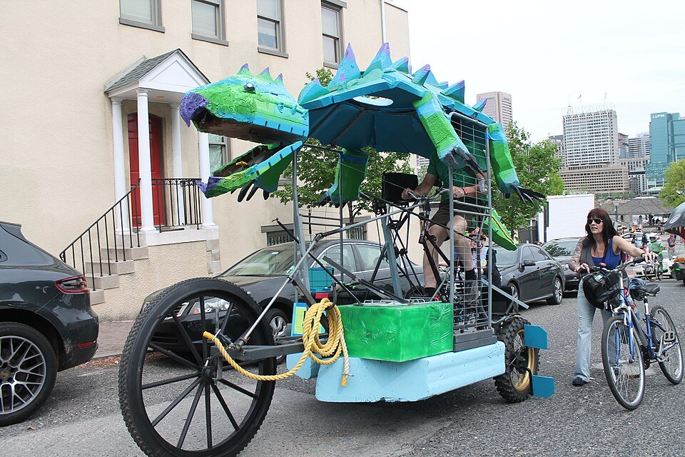 A dragon-shaped kinetic sculpture on a street in Federal Hill, Baltimore