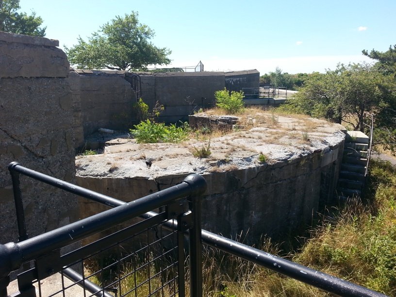 Battery Adams at Fort Warren, concrete emplacements behind a railing
