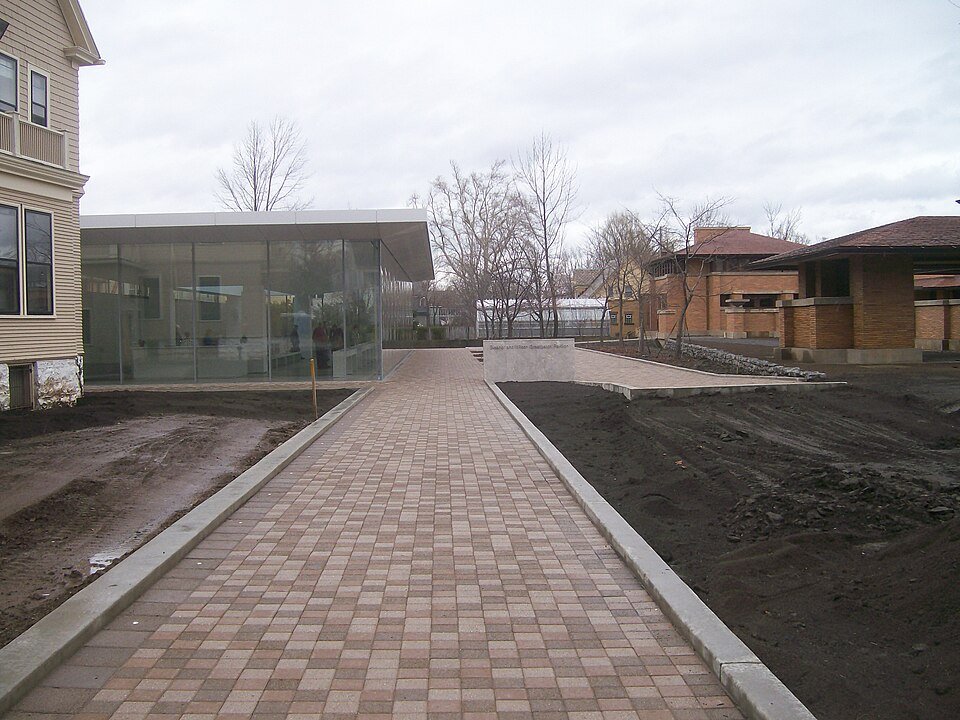 The entrance path of the Darwin D. Martin House, with the glass-walled visitor center on the left (2009)
