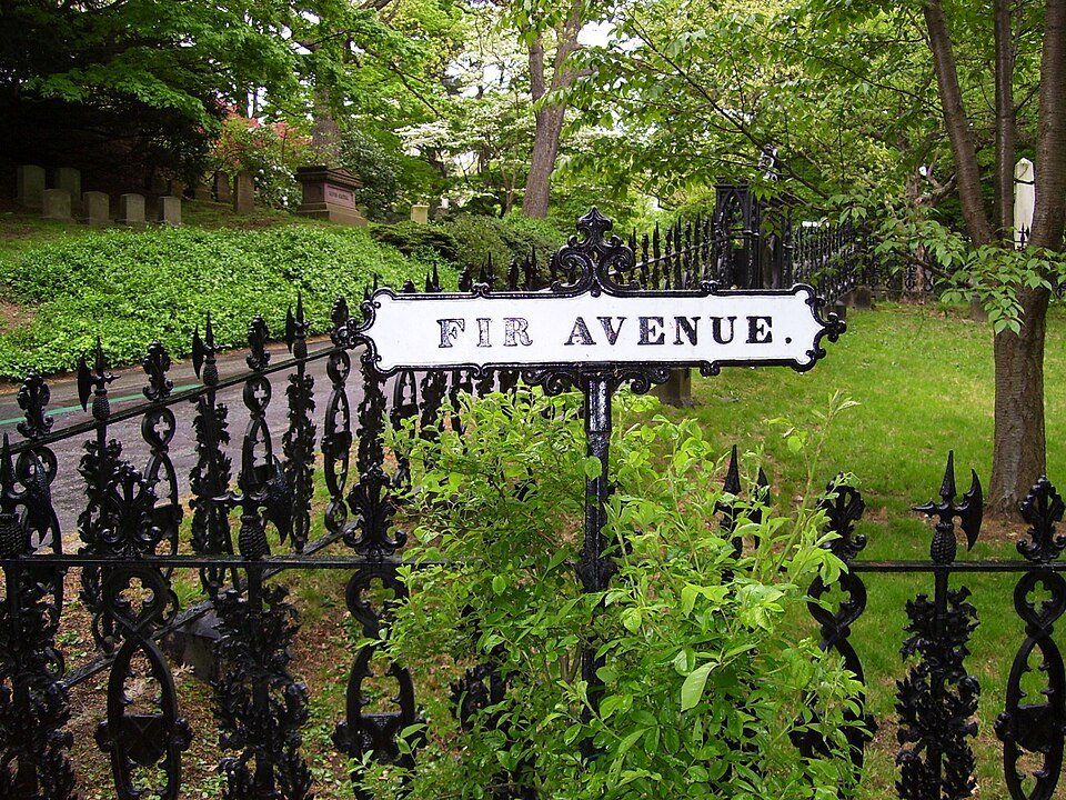 Cast-iron fence and the Fir Avenue street sign at Mount Auburn Cemetery
