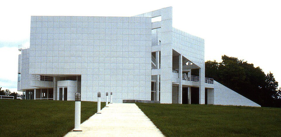 The Atheneum in New Harmony, Indiana, a modern white building with a walkway across the lawn, photographed in 1979