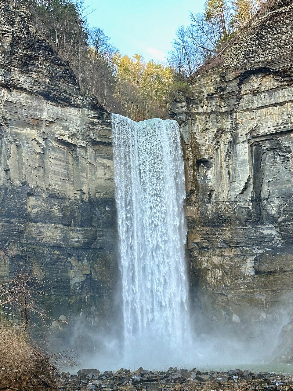 Close view of the main falls from near its base, with spray rising from the plunge pool
