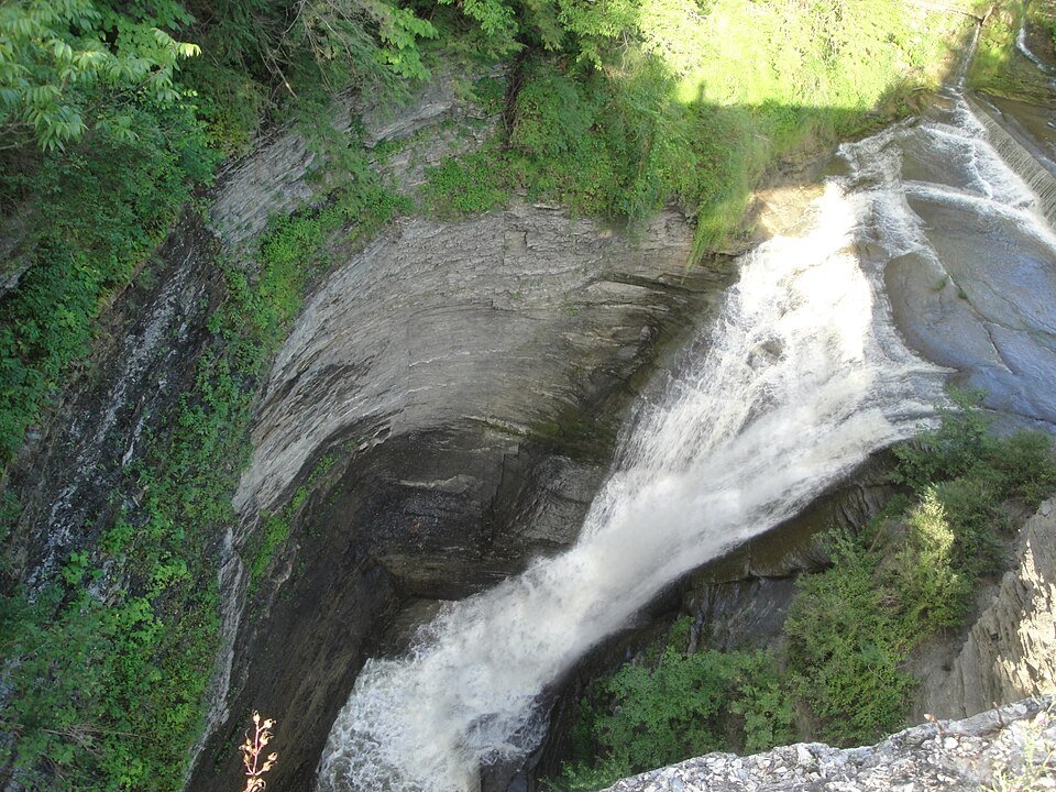 The Upper Falls seen from above, curving over a rock ledge