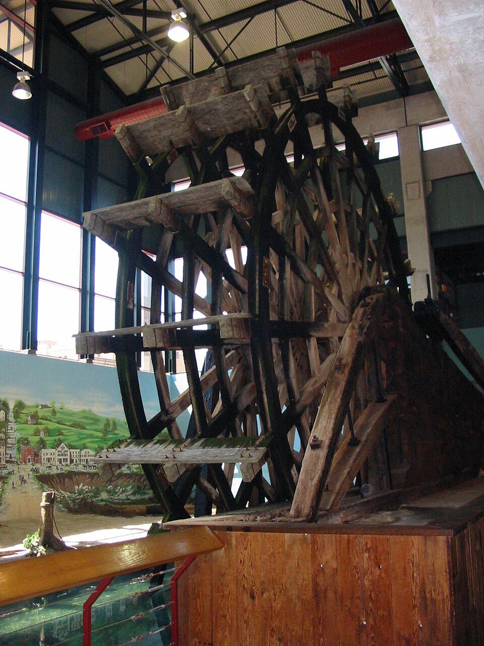 A large wooden paddle wheel displayed inside the Arabia Steamboat Museum