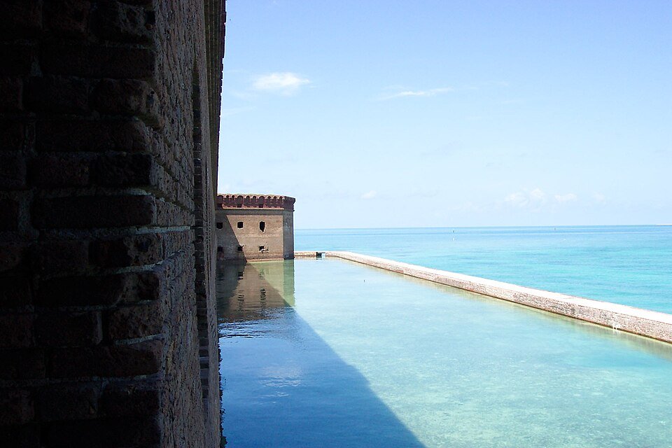 Moat and brick wall of Fort Jefferson beside the sea