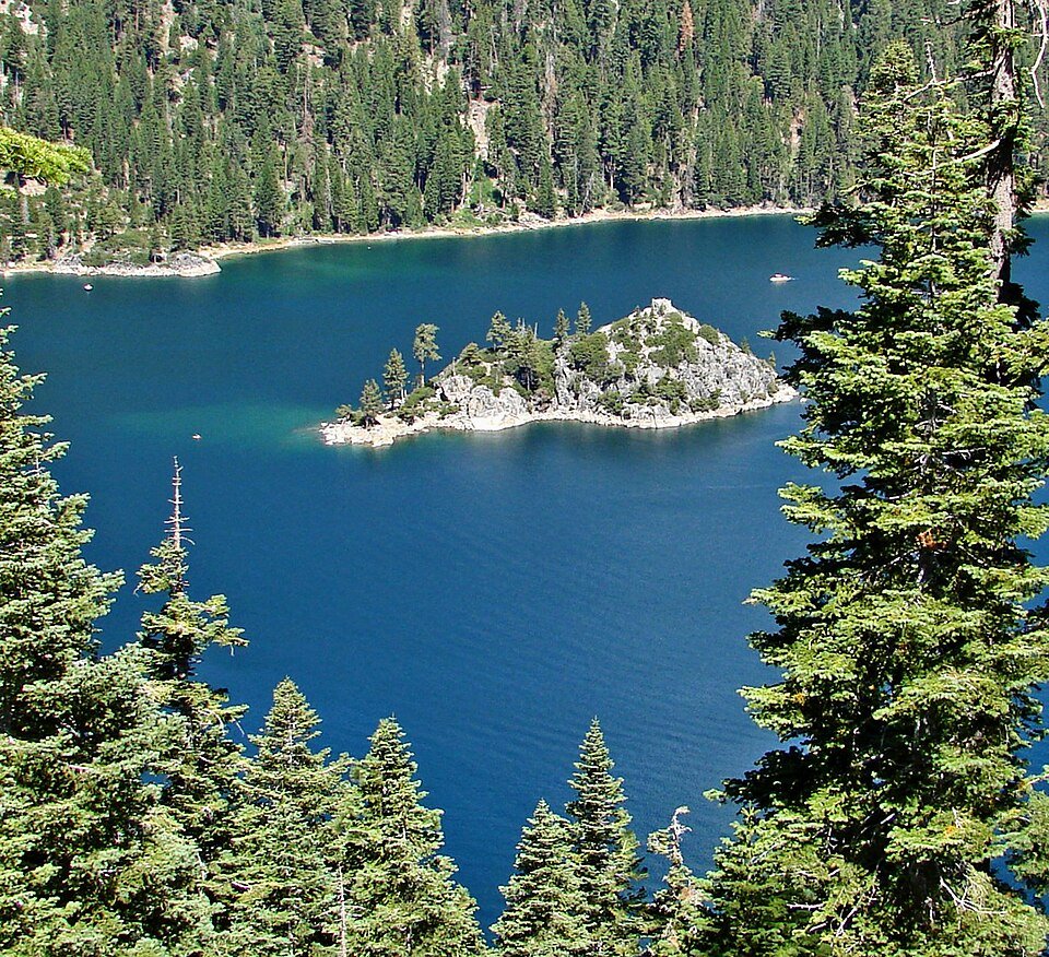 Fannette Island in the blue water of Emerald Bay, surrounded by forested slopes
