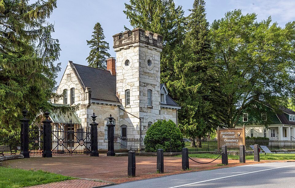 Stone entrance lodge and iron gate of Antietam National Cemetery in Sharpsburg, Maryland
