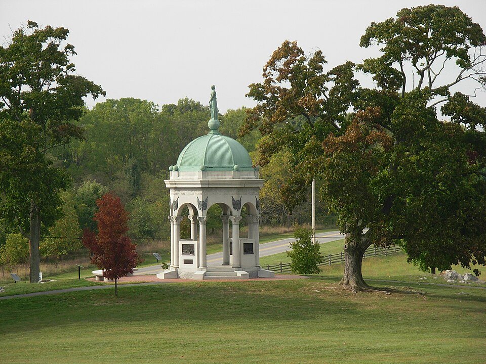 A domed stone memorial among trees on Antietam National Battlefield