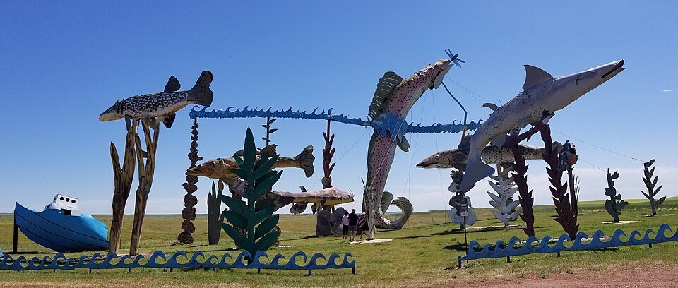 Fish sculptures, a boat and waves made of scrap metal at Fisherman's Dream on the Enchanted Highway