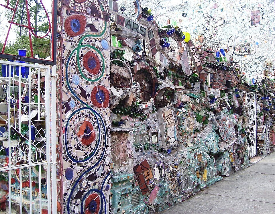 A mosaic wall and gate along the sidewalk at the Magic Gardens, South Street, Philadelphia