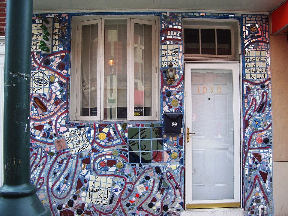 A mosaic doorway with faces and tile on South Street, Philadelphia