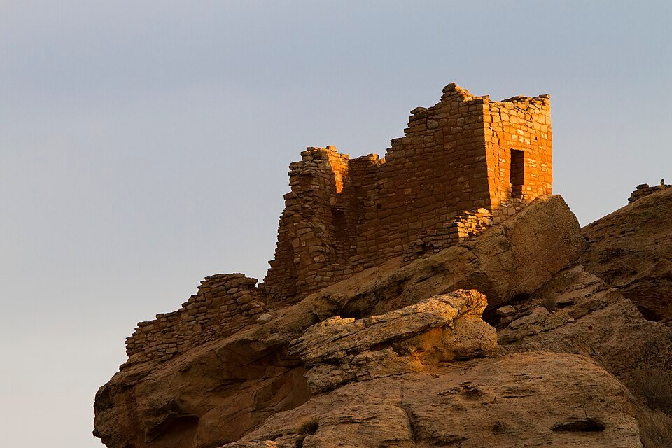 Stronghold House in the Square Tower group at Hovenweep, lit by low sun on its rock perch